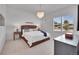 Bright bedroom with a chandelier, comfortable bed, and plenty of natural light through the window at 9228 Lone Timber Ct, Parker, CO 80134