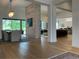 Open-concept dining room with modern lighting and scenic views from the large window at 9228 Lone Timber Ct, Parker, CO 80134
