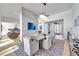 Spacious dining room featuring modern decor, open to the living room and kitchen at 9228 Lone Timber Ct, Parker, CO 80134