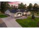 Stunning home with a three-car garage, beautiful landscaping, and a long driveway at 9228 Lone Timber Ct, Parker, CO 80134