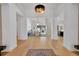 Open-concept foyer with hardwood floors and views of the dining room and living area at 9228 Lone Timber Ct, Parker, CO 80134
