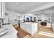 Open-concept kitchen flows into a living area with a fireplace, creating a warm and inviting atmosphere at 9228 Lone Timber Ct, Parker, CO 80134