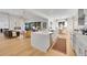 Open-concept kitchen with a large island, hardwood floors, and seamless flow to the living area at 9228 Lone Timber Ct, Parker, CO 80134