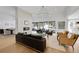 Bright, airy living room featuring a fireplace, high ceilings, large windows and hardwood floors at 9228 Lone Timber Ct, Parker, CO 80134