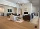 Bright living room featuring a modern fireplace, wood floors, and elegant decor at 9228 Lone Timber Ct, Parker, CO 80134