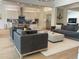 Open-concept living room with modern furnishings flowing into a spacious kitchen with stainless steel appliances at 9228 Lone Timber Ct, Parker, CO 80134