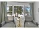 Bright living room featuring a cozy sitting area with beautiful views of the surrounding nature at 9228 Lone Timber Ct, Parker, CO 80134