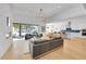 Bright living room with fireplace, large windows, hardwood floors, and open floor plan at 9228 Lone Timber Ct, Parker, CO 80134