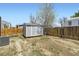 Backyard featuring a shed and wooden fence at 1958 Cathay Ct, Aurora, CO 80011