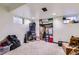 Unfinished basement with ample storage space and natural light from the window at 1958 Cathay Ct, Aurora, CO 80011