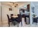 Cozy dining room with seating for four and views into the kitchen at 1958 Cathay Ct, Aurora, CO 80011