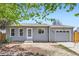 Charming one-story home featuring a garage, light gray siding and a well-manicured lawn at 1958 Cathay Ct, Aurora, CO 80011