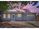 Charming one-story home featuring a garage, light gray siding and a well-manicured lawn at 1958 Cathay Ct, Aurora, CO 80011