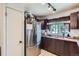 Modern kitchen with stainless steel appliances, brown cabinets, and granite countertops at 1958 Cathay Ct, Aurora, CO 80011
