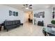 Bright living room view featuring tile flooring, modern décor, and a connecting dining area at 1958 Cathay Ct, Aurora, CO 80011