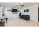 Bright living room featuring tile floors, a ceiling fan, and a modern sofa at 1958 Cathay Ct, Aurora, CO 80011