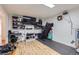 Room has wood floors, tv, and workout equipment at 1958 Cathay Ct, Aurora, CO 80011
