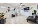 Bright living room with tile flooring, a ceiling fan, and a futon sofa at 1958 Cathay Ct, Aurora, CO 80011