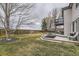 Large backyard featuring a spacious deck and patio area and mature trees at 10767 Appaloosa Ct, Parker, CO 80134