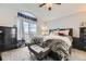 Spacious bedroom with vaulted ceiling, sliding glass doors, and comfortable seating at 10767 Appaloosa Ct, Parker, CO 80134