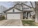 Charming two-story home featuring a two-car garage and stone accents at 10767 Appaloosa Ct, Parker, CO 80134