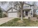 Charming two-story home featuring a two-car garage and stone accents at 10767 Appaloosa Ct, Parker, CO 80134