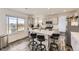 Bright kitchen with center island, modern appliances, and mountain views at 10767 Appaloosa Ct, Parker, CO 80134