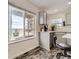The cozy kitchen features stainless steel appliances, a breakfast bar, and a view to the backyard at 10767 Appaloosa Ct, Parker, CO 80134