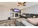 Cozy living room with fireplace and entertainment center at 10767 Appaloosa Ct, Parker, CO 80134