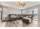 Spacious living room with hardwood floors, lots of seating, and natural light at 10767 Appaloosa Ct, Parker, CO 80134