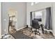 Office space with hardwood floors, grey walls and lots of natural light at 10767 Appaloosa Ct, Parker, CO 80134