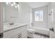 This bathroom features a toilet, shower over tub, white vanity, a mirror and good lighting at 17634 E Ohio Cir, Aurora, CO 80017