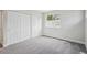 This bedroom features a window, double door closet and light walls with gray carpet at 17634 E Ohio Cir, Aurora, CO 80017