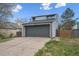 Two-story home featuring neutral siding, a two car garage, and a concrete driveway at 17634 E Ohio Cir, Aurora, CO 80017