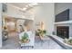 Open living room with fireplace, stairs, and skylights creates a bright and inviting living space at 17634 E Ohio Cir, Aurora, CO 80017
