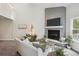 Cozy living room with fireplace, TV, and comfy seating offers an inviting space for relaxation and entertainment at 17634 E Ohio Cir, Aurora, CO 80017