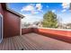 A bright and sunny outdoor patio with wood paneled flooring and a wood paneled wall at 8424 Everett Way # E, Arvada, CO 80005