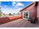 Outdoor balcony with wood flooring and space for relaxing while enjoying scenic neighborhood views at 8424 Everett Way # E, Arvada, CO 80005