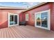 A charming deck with bench seating and sliding glass doors at 8424 Everett Way # E, Arvada, CO 80005