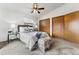 Bedroom featuring a ceiling fan, two large closets, and a cozy sitting area at 8424 Everett Way # E, Arvada, CO 80005