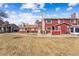 Exterior view of a townhouse featuring a well-kept lawn and inviting entryway at 8424 Everett Way # E, Arvada, CO 80005