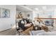 Open-concept living area with comfortable seating, modern decor, and lots of light at 8424 Everett Way # E, Arvada, CO 80005