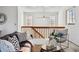 Bright living room featuring a loft, comfortable seating, and lots of natural light at 8424 Everett Way # E, Arvada, CO 80005