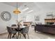 Cozy living area featuring a loft, modern decor, fireplace, and lots of natural light at 8424 Everett Way # E, Arvada, CO 80005