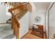 Inviting staircase with wooden railings, carpeted steps, and a bench at the landing at 8424 Everett Way # E, Arvada, CO 80005