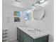 Bright double vanity bath with unique finishes and dual mirrors at 1740 Trenton St, Denver, CO 80220