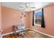Cozy peach bedroom with hardwood floors and natural light from the window at 1740 Trenton St, Denver, CO 80220