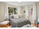 Serene bedroom with natural light, soft textures, and a comfortable bed at 2644 N Glencoe St, Denver, CO 80207