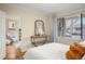 Bright bedroom with hardwood floors, a stylish console table, and ample natural light at 2644 N Glencoe St, Denver, CO 80207