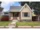 Charming brick home with a well-maintained front yard and inviting entryway at 2644 N Glencoe St, Denver, CO 80207